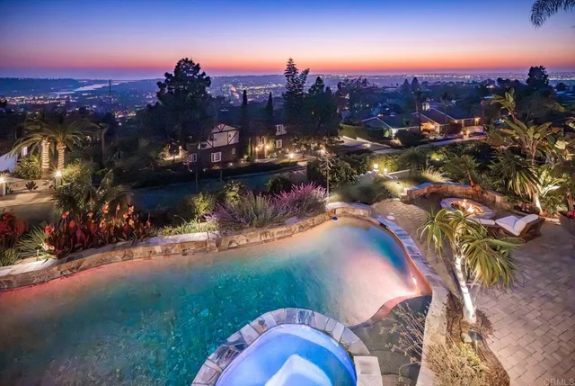 a front view of a multi story building with yard