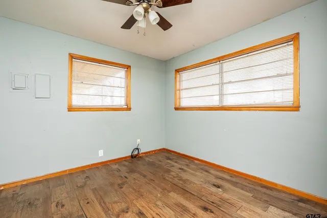 a view of a kitchen with a dishwasher and wooden floor