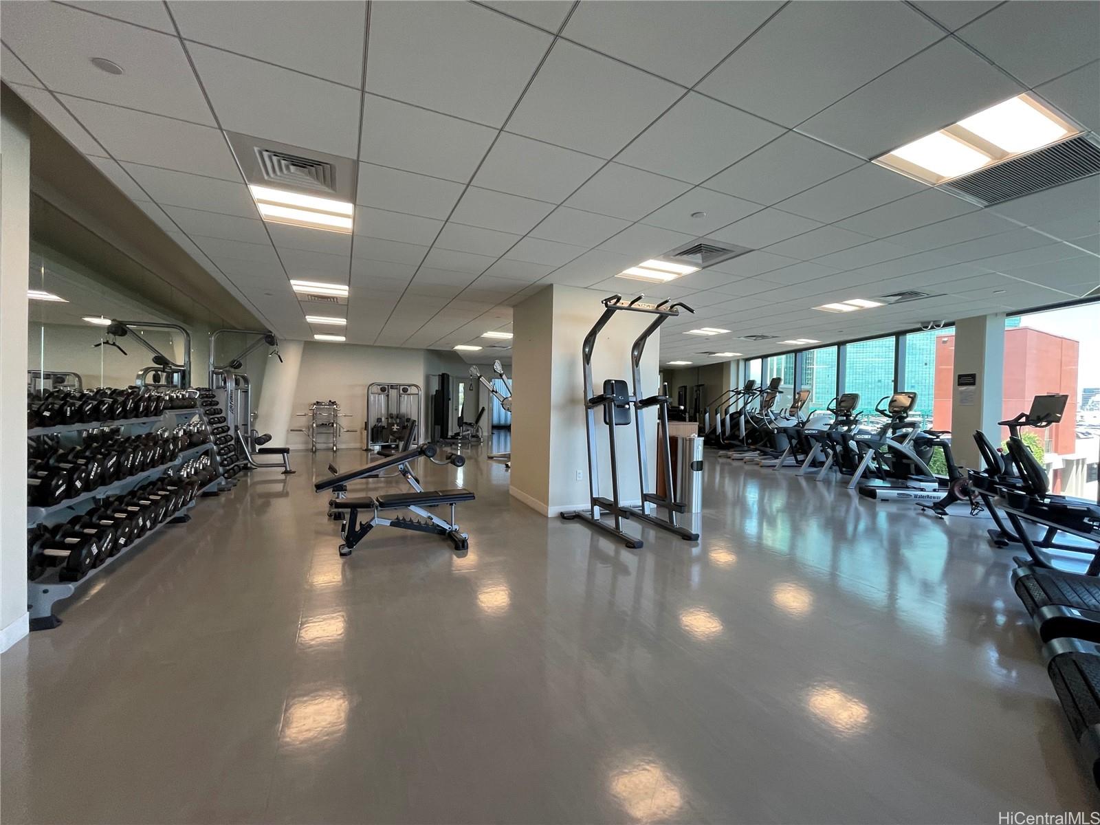 1108 Auahi Street, Unit PH3403 Honolulu, HI 96814 - Photo 18 of 24 a gym room with lots of gym equipment