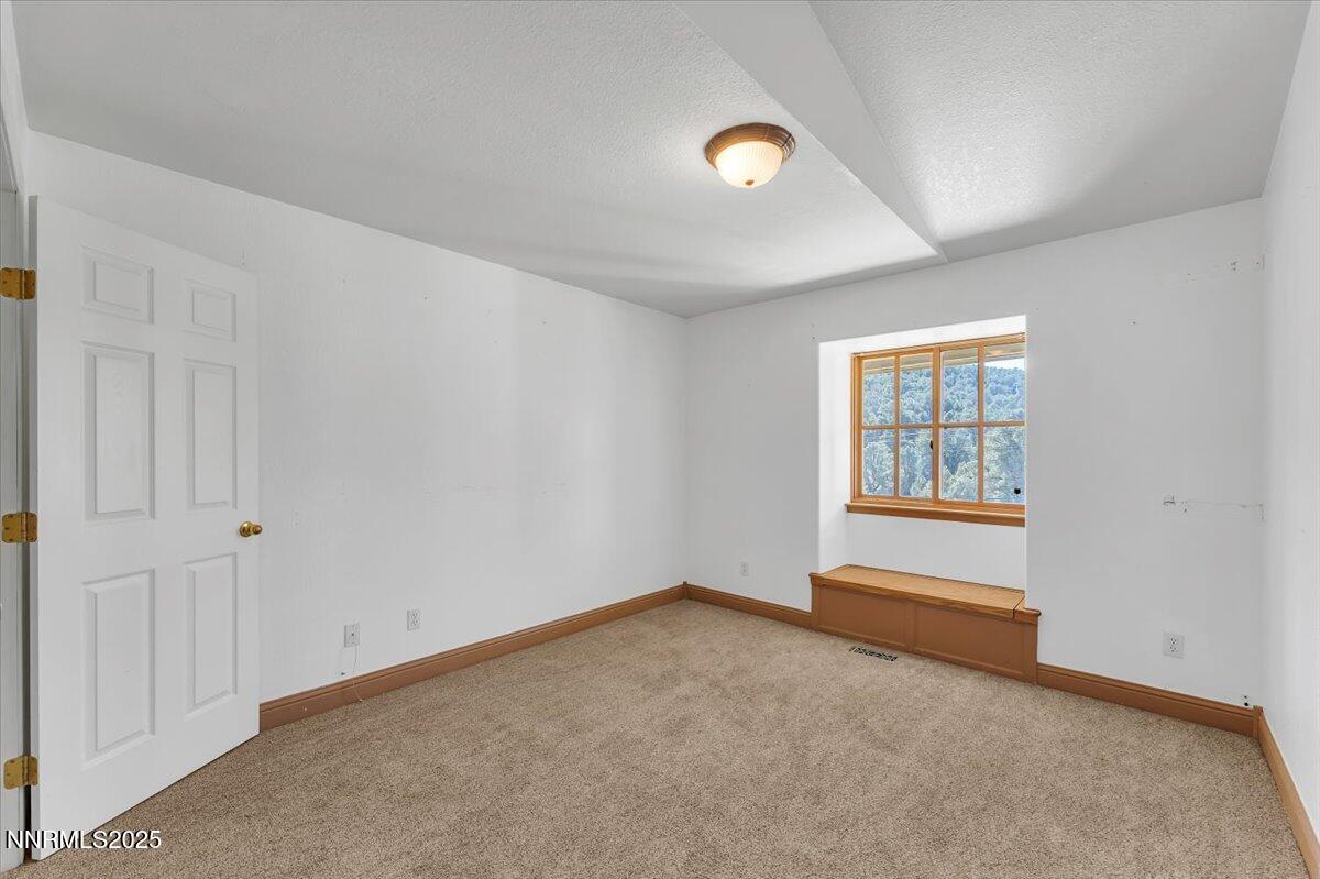 21410 Sazarac Road Reno, NV 89521 - Photo 14 of 41 an empty room with windows