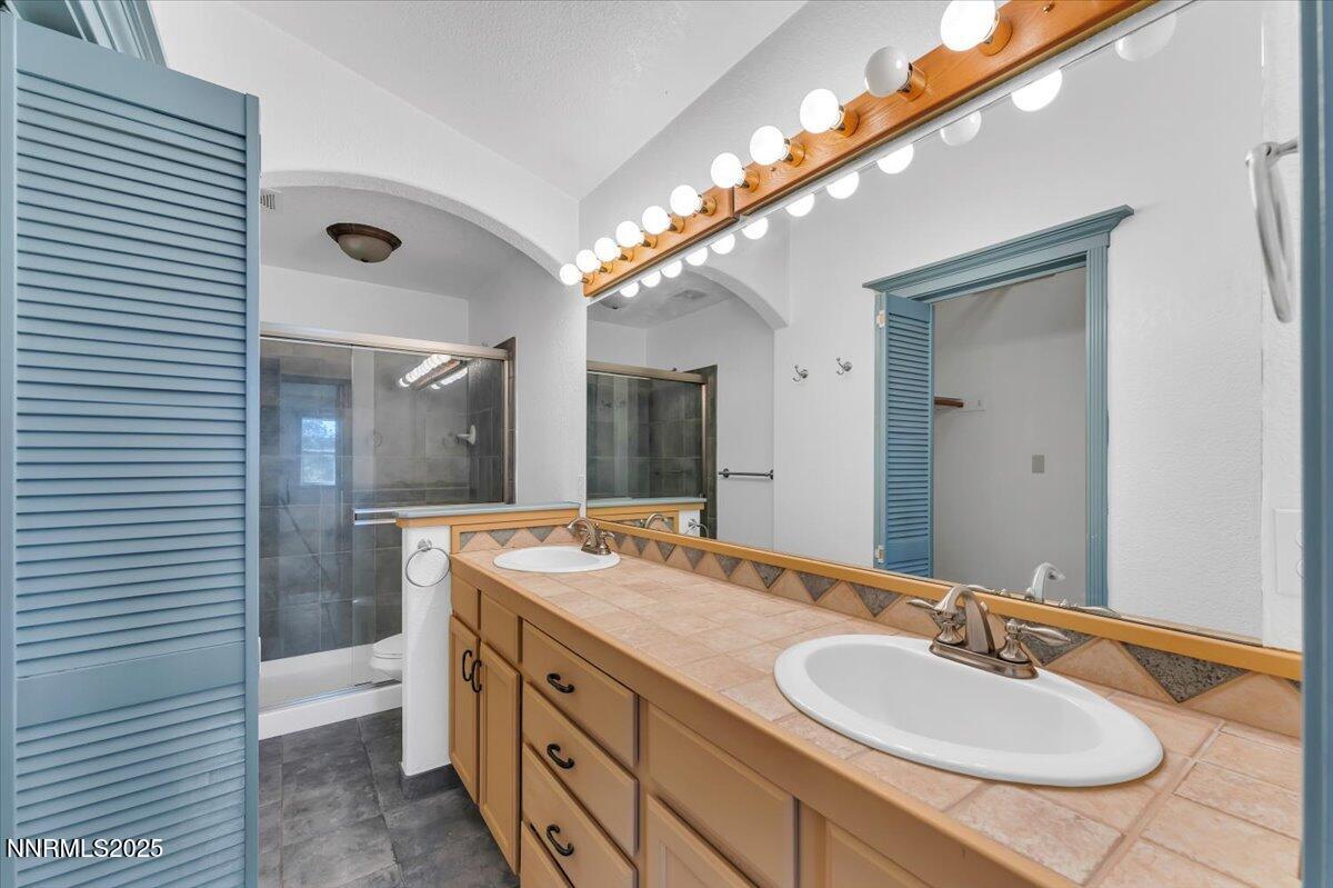 21410 Sazarac Road Reno, NV 89521 - Photo 17 of 41 a bathroom with a sink double vanity and a mirror