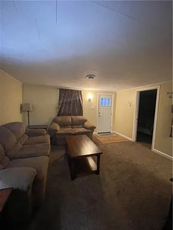 a bedroom with a bed and a night stand