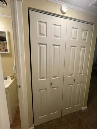 a bathroom with a shower a toilet and a sink