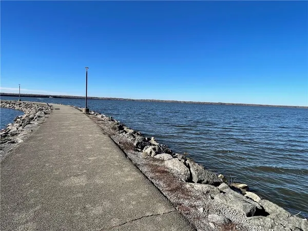 a view of a lake with sunset