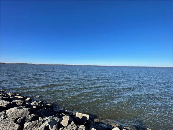 a view of a swimming pool with an outdoor seating