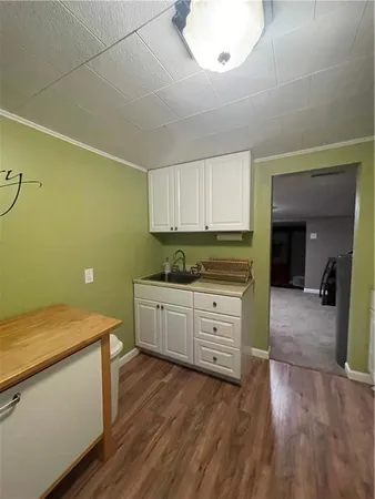 a living room with furniture and a lamp