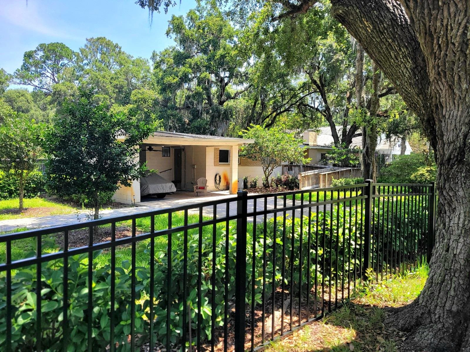 930 Highway 16 St. Augustine, FL 32084 - Photo 13 of 27 a front view of a house with a garden
