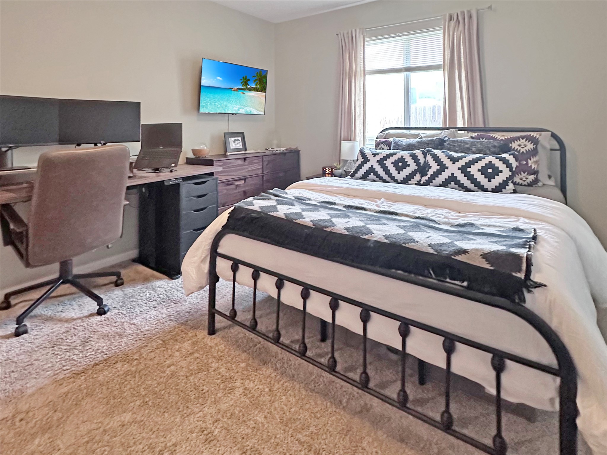 20213 Kearney Hill Road Pflugerville, TX 78660 - Photo 23 of 27 A well-lit bedroom provides comfortable living space.