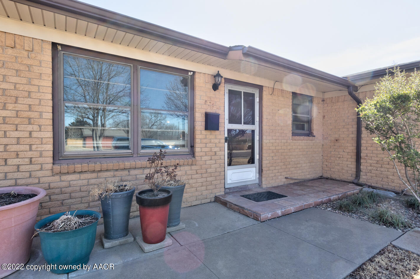 5015 South Milam Street Amarillo, TX 79110 - Photo 2 of 15 a front view of a house with outdoor seating