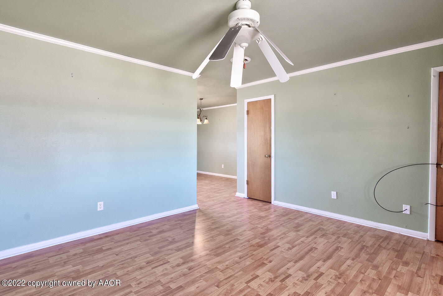 5015 South Milam Street Amarillo, TX 79110 - Photo 3 of 15 a view of a room with wooden floor and white walls