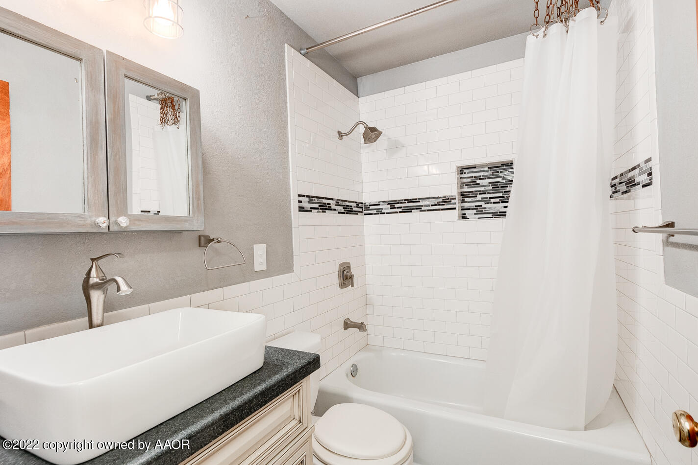 5015 South Milam Street Amarillo, TX 79110 - Photo 10 of 15 a bathroom with a sink toilet and shower