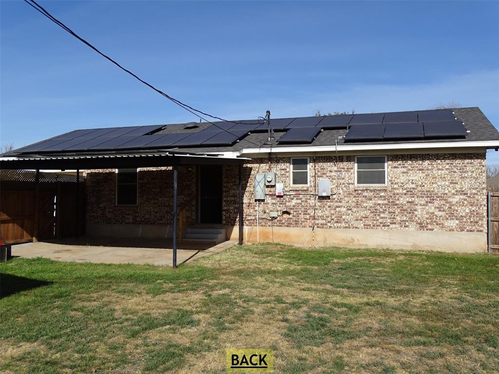 908 Brookside Street Sweetwater, TX 79556 - Photo 15 of 20 a view of a back yard of the house