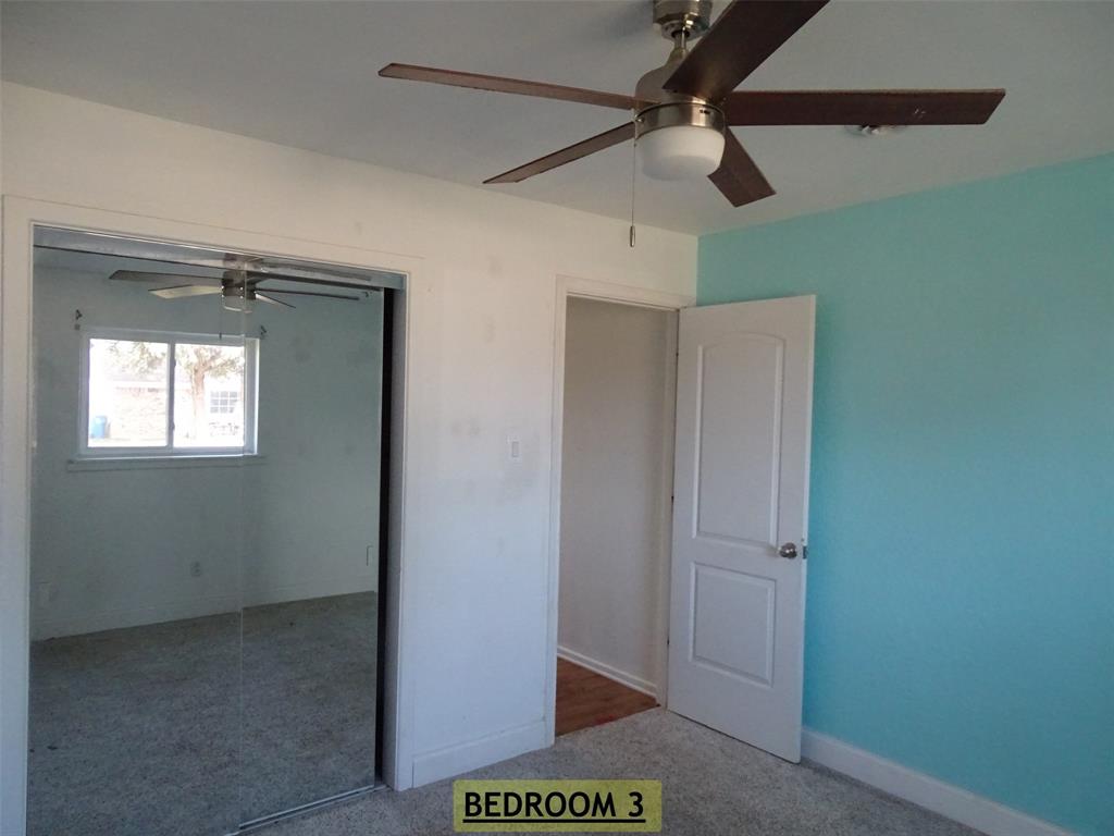 908 Brookside Street Sweetwater, TX 79556 - Photo 9 of 20 a view of hallway with a fan