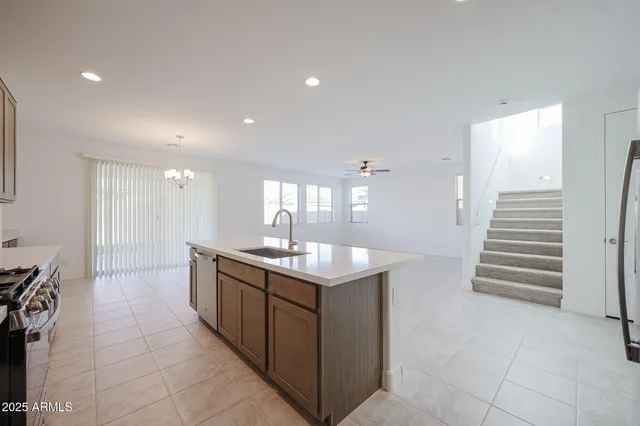 a kitchen with stainless steel appliances granite countertop a sink and cabinets