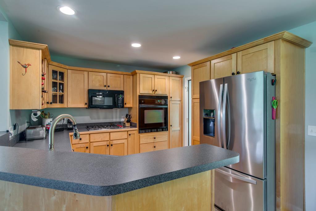 1102 Center Point Road Hendersonville, TN 37075 - Photo 11 of 30 a kitchen with stainless steel appliances granite countertop a refrigerator a stove and a sink