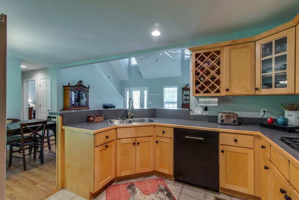 1102 Center Point Road Hendersonville, TN 37075 - Photo 13 of 30 a kitchen with stainless steel appliances granite countertop a sink and cabinets