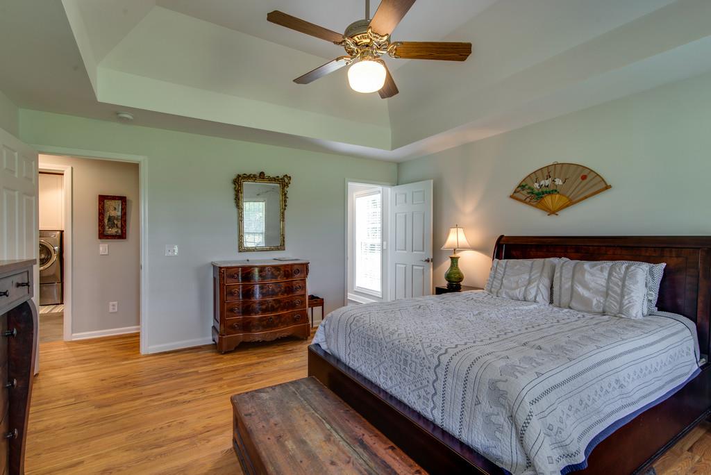 1102 Center Point Road Hendersonville, TN 37075 - Photo 16 of 30 a bedroom with a bed and wooden floor