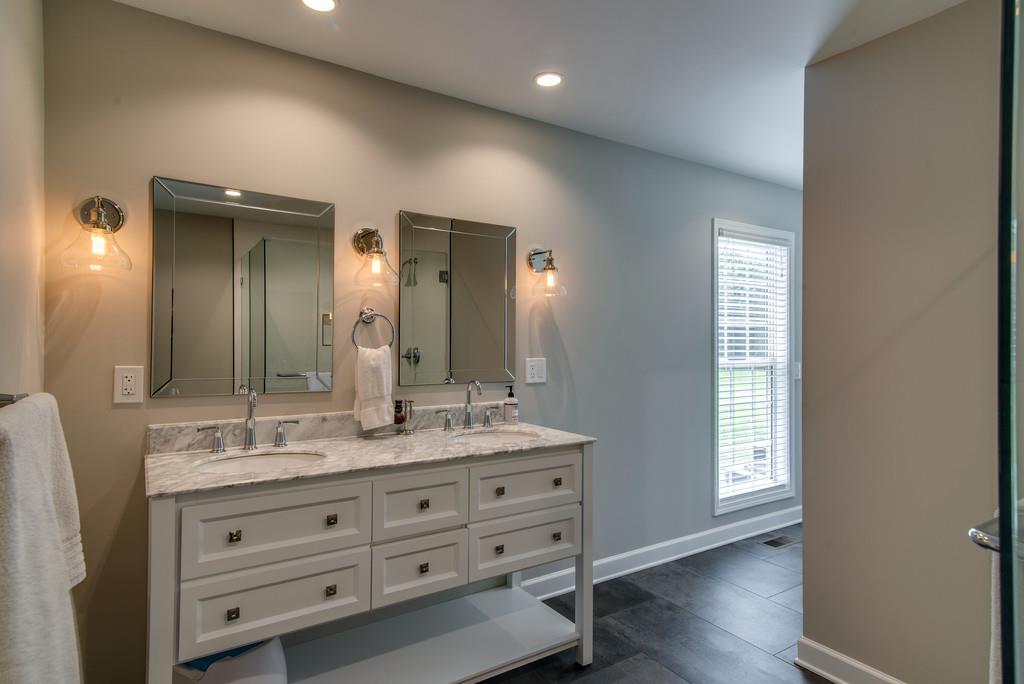 1102 Center Point Road Hendersonville, TN 37075 - Photo 18 of 30 a bathroom with a double vanity sink and a mirror