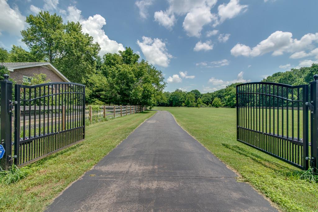 1102 Center Point Road Hendersonville, TN 37075 - Photo 2 of 30 a view of a wrought iron fences in front of a house