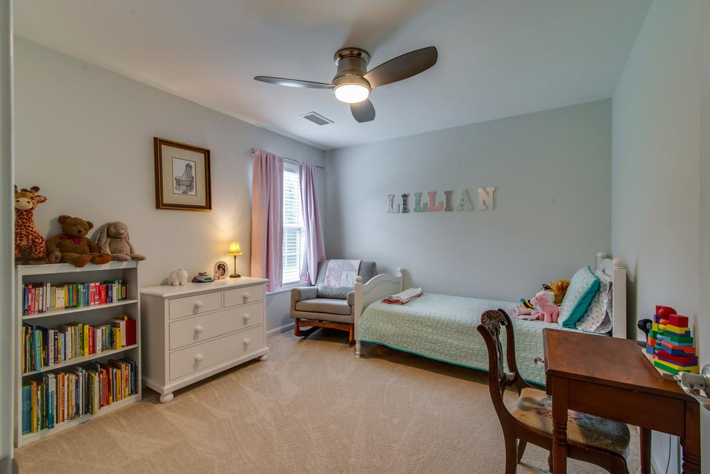 1102 Center Point Road Hendersonville, TN 37075 - Photo 23 of 30 a bedroom with furniture and a book shelf