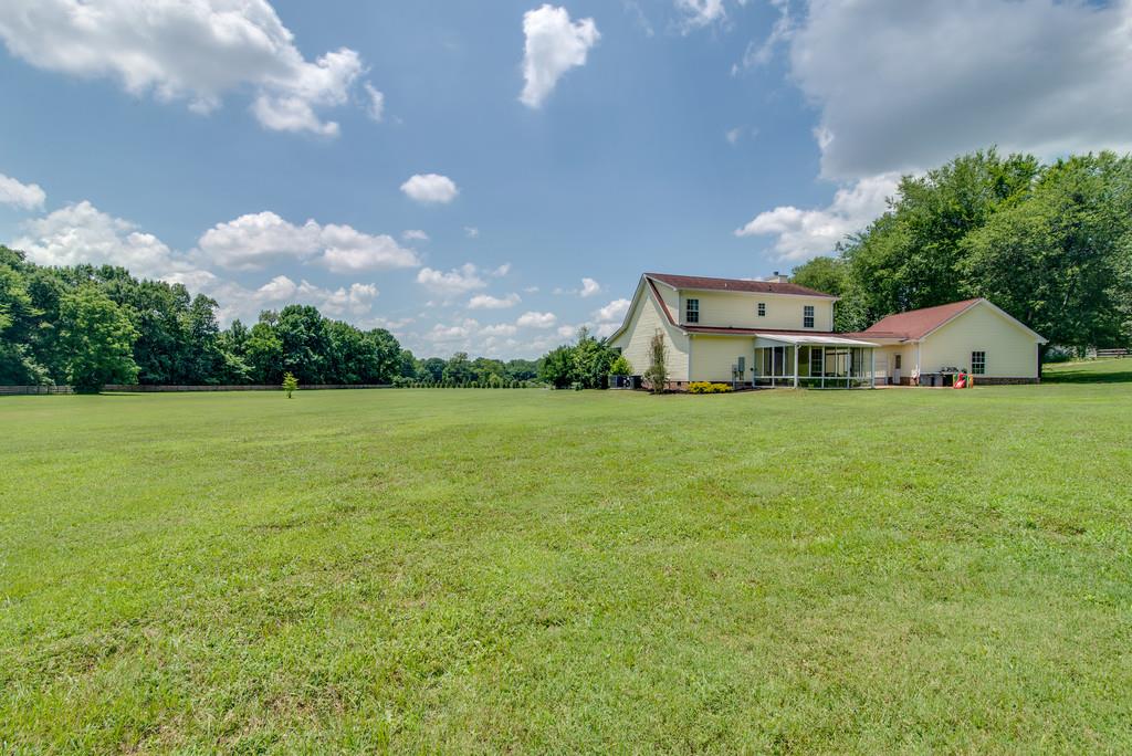 1102 Center Point Road Hendersonville, TN 37075 - Photo 26 of 30 a view of a house with a yard and garage