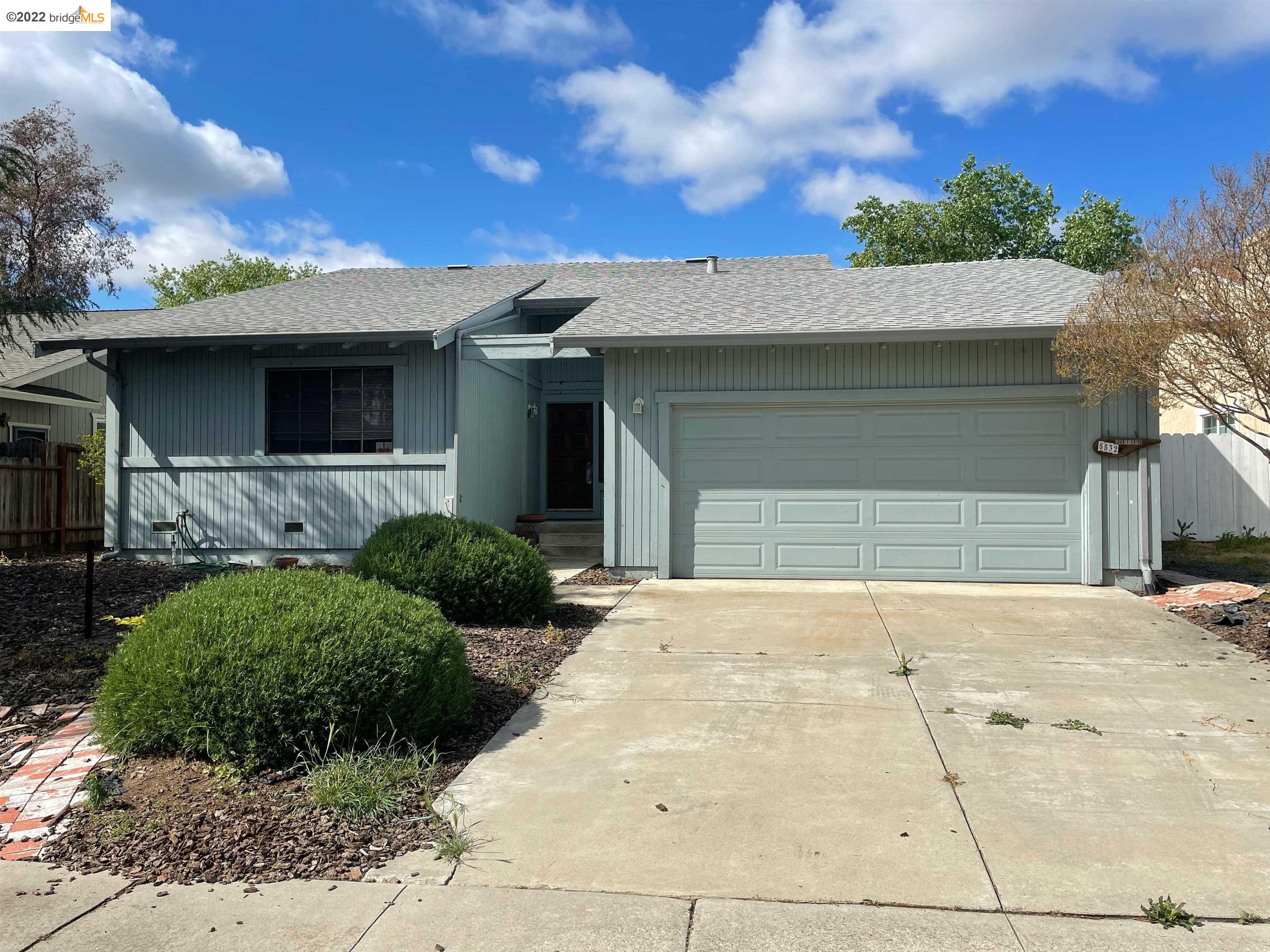5532 Riverlake Road Discovery Bay, CA 94505 - Photo 1 of 1 a front view of a house with a yard and garage