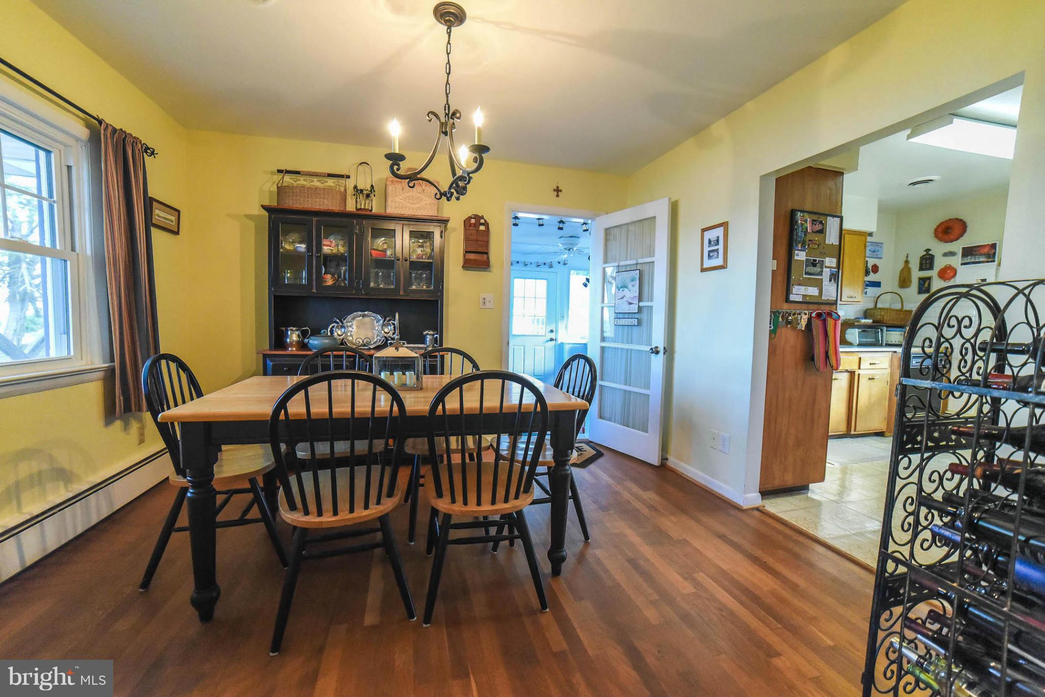 16466 Piney Point Road Piney Point, MD 20674 - Photo 11 of 27 a view of a dining room with furniture window and wooden floor