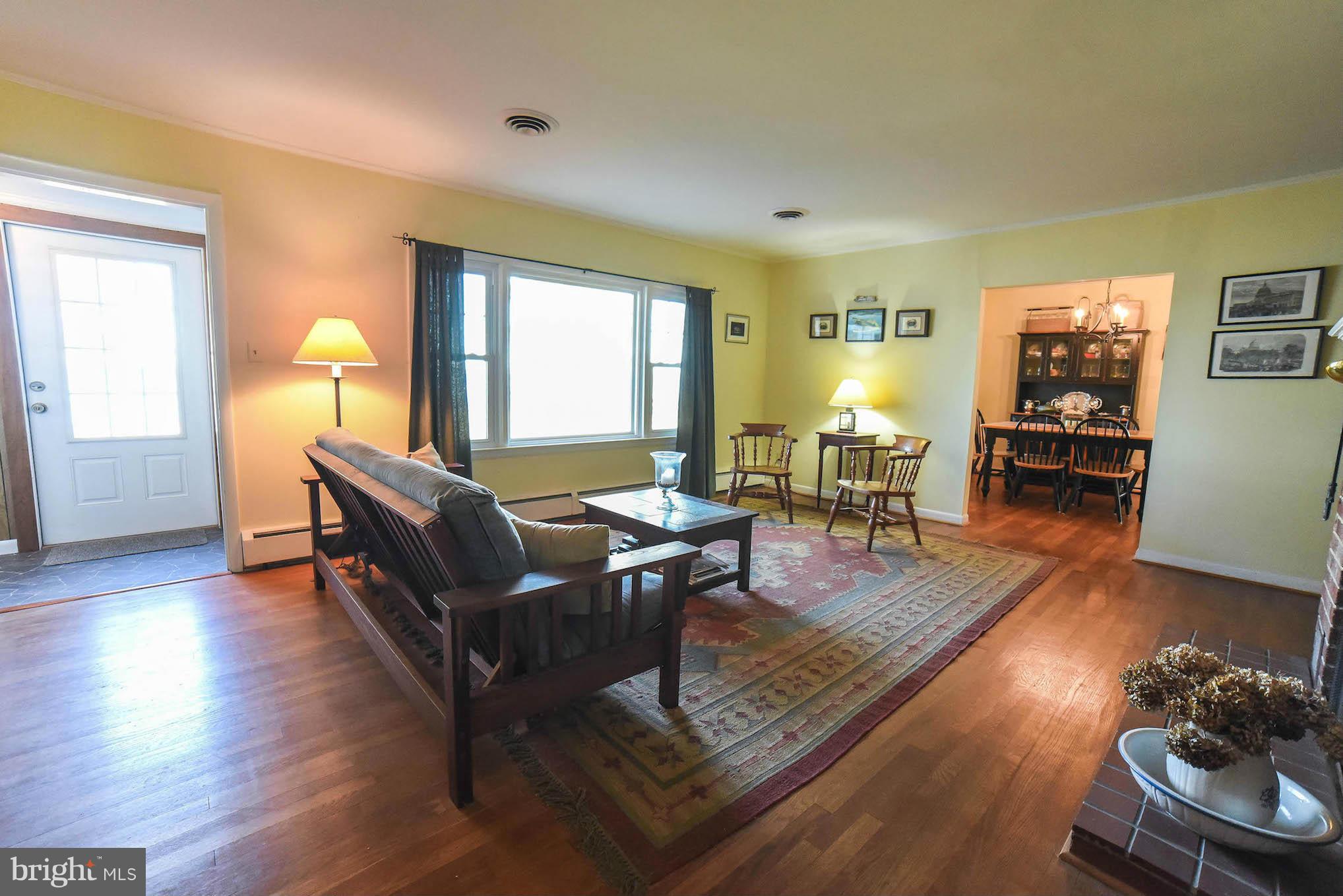 16466 Piney Point Road Piney Point, MD 20674 - Photo 12 of 27 a living room with furniture and wooden floor
