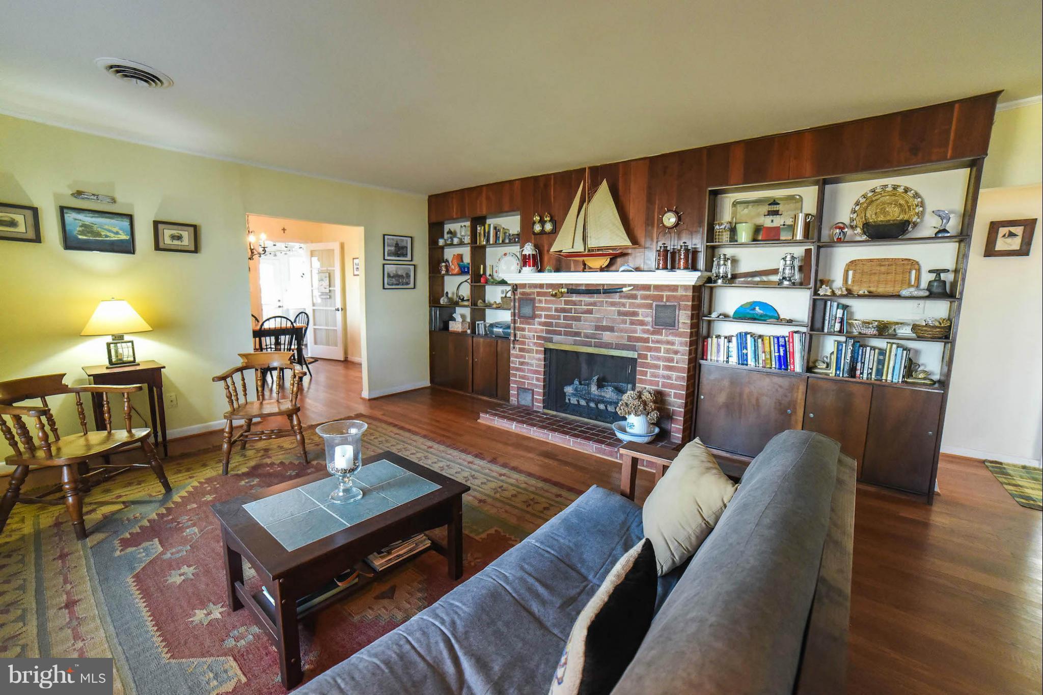 16466 Piney Point Road Piney Point, MD 20674 - Photo 13 of 27 a living room with furniture and a fireplace