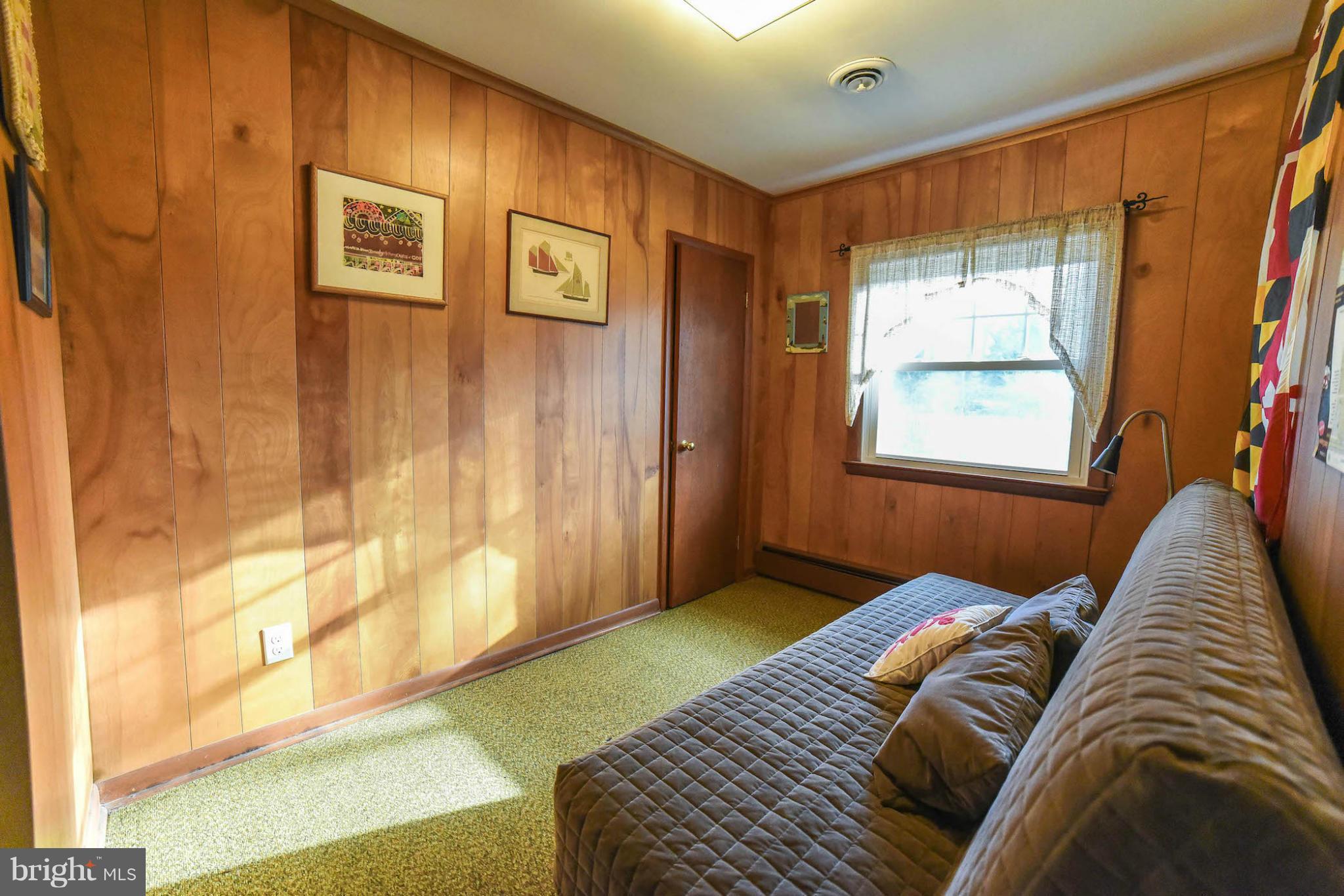 16466 Piney Point Road Piney Point, MD 20674 - Photo 16 of 27 a bedroom with a bed and a window