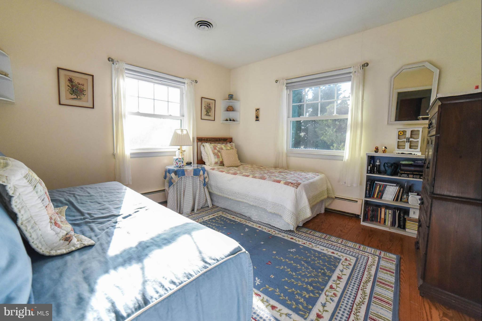 16466 Piney Point Road Piney Point, MD 20674 - Photo 17 of 27 a bedroom with a bed furniture and a window