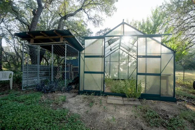 a backyard of a house with lots of green space