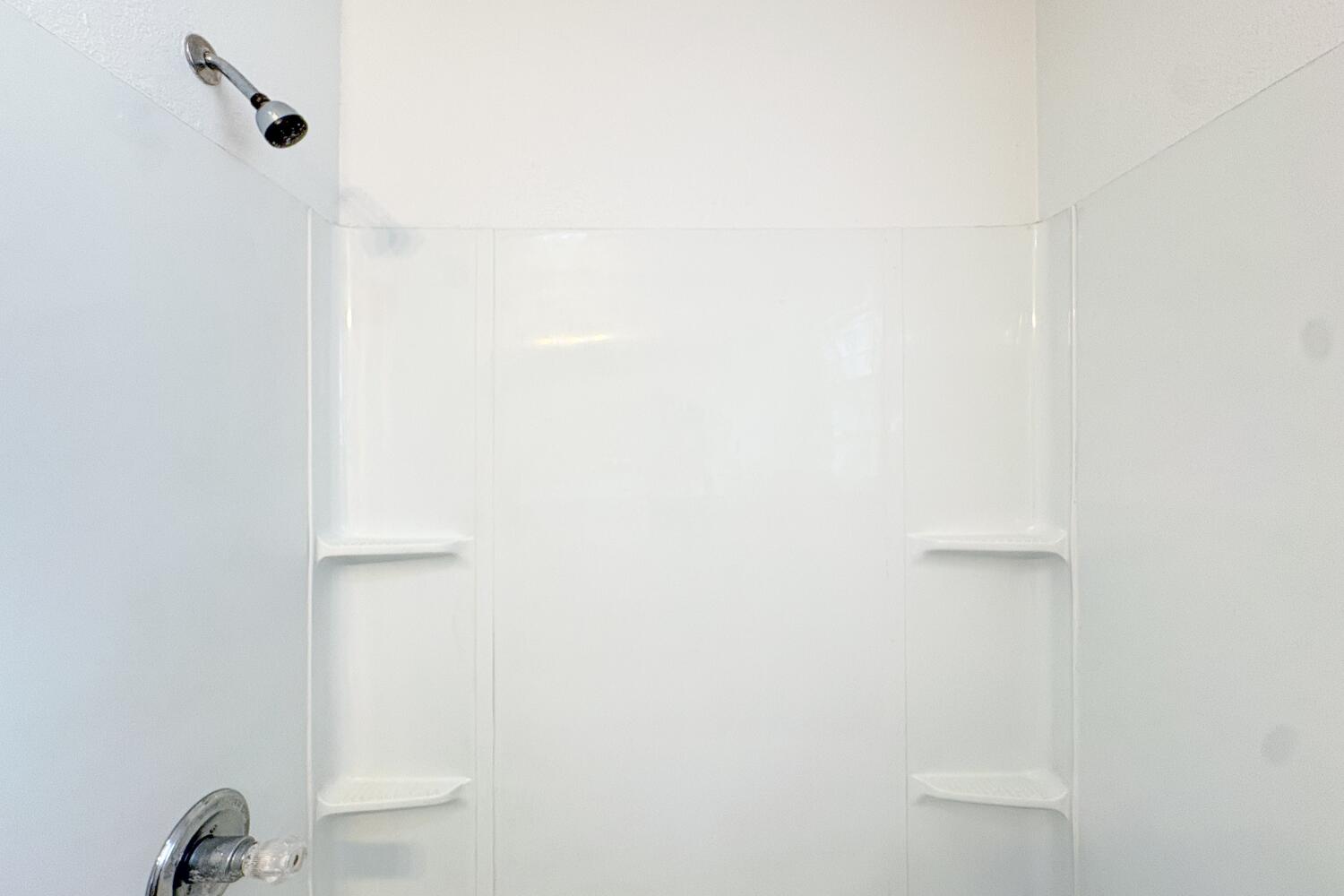 809 West 5th Street Wolfforth, TX 79382 - Photo 17 of 23 a bathroom with a shower