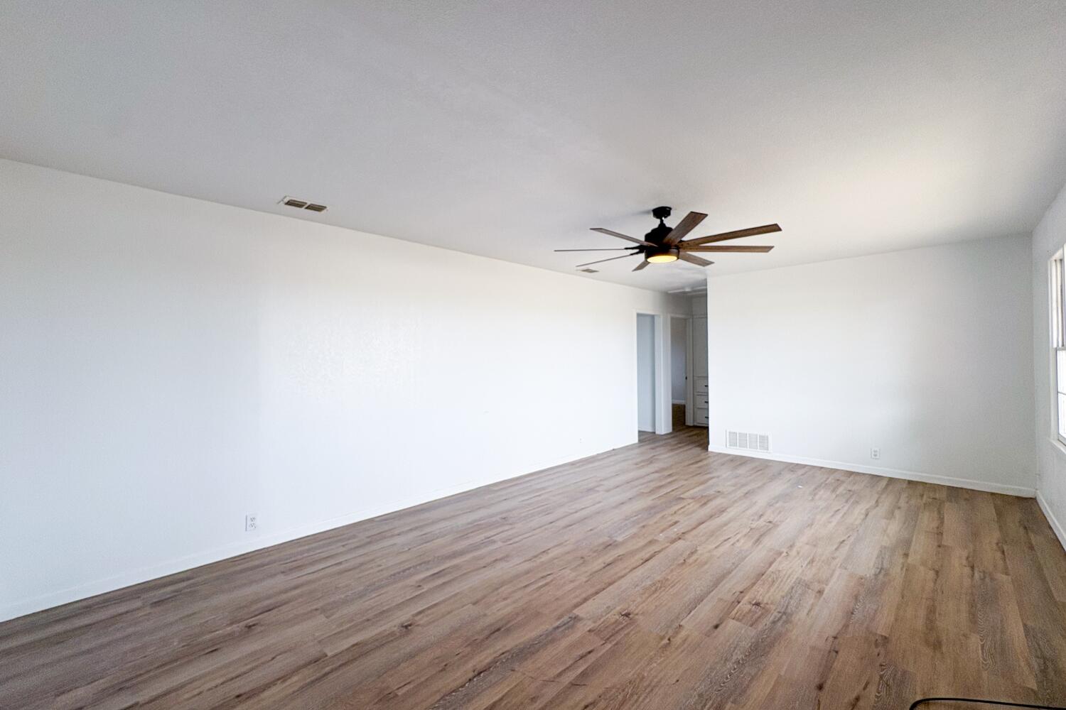 809 West 5th Street Wolfforth, TX 79382 - Photo 2 of 23 a view of a room with wooden floor