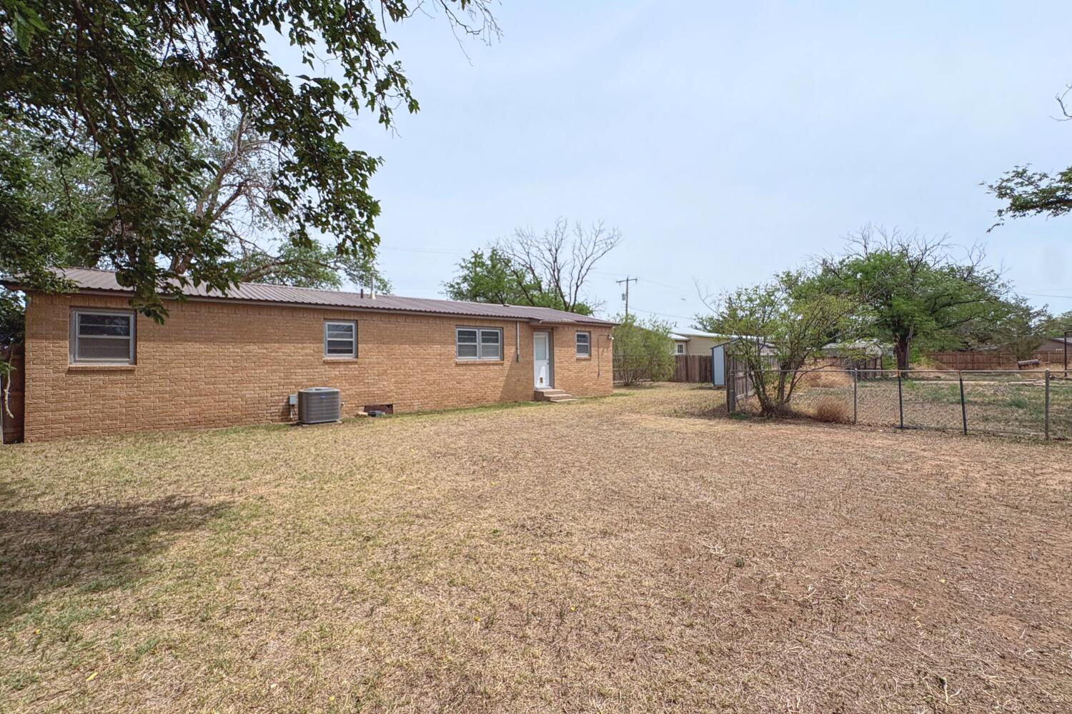 809 West 5th Street Wolfforth, TX 79382 - Photo 21 of 23 front view of a house with a yard and a garage