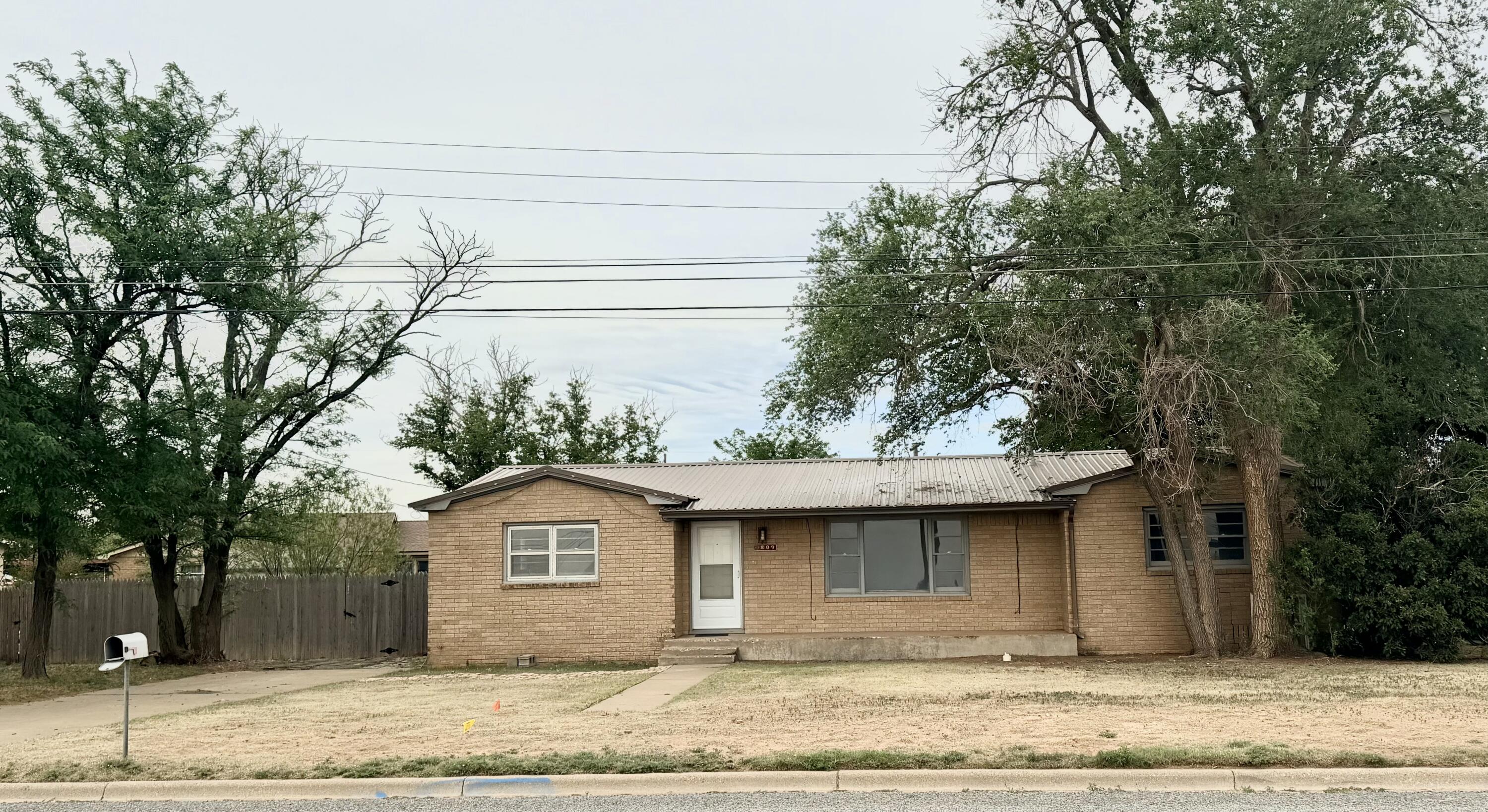 809 West 5th Street Wolfforth, TX 79382 - Photo 23 of 23 a front view of a house with a garden