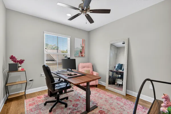 a workspace with furniture and window