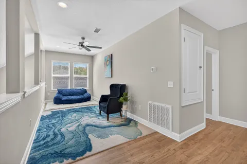 a living room with furniture and a window