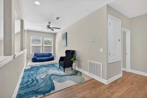 a living room with furniture and a window