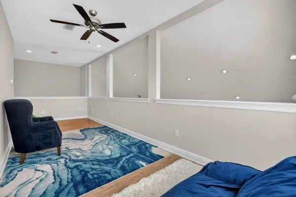 a living room with furniture and a rug