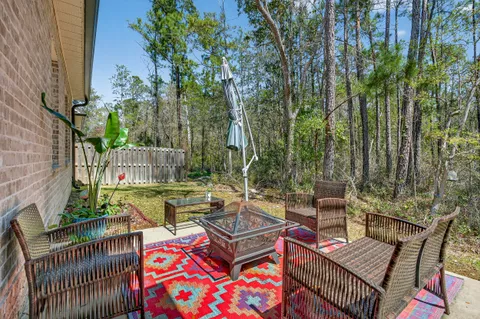 a view of a backyard with sitting area