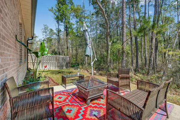 a view of a backyard with sitting area