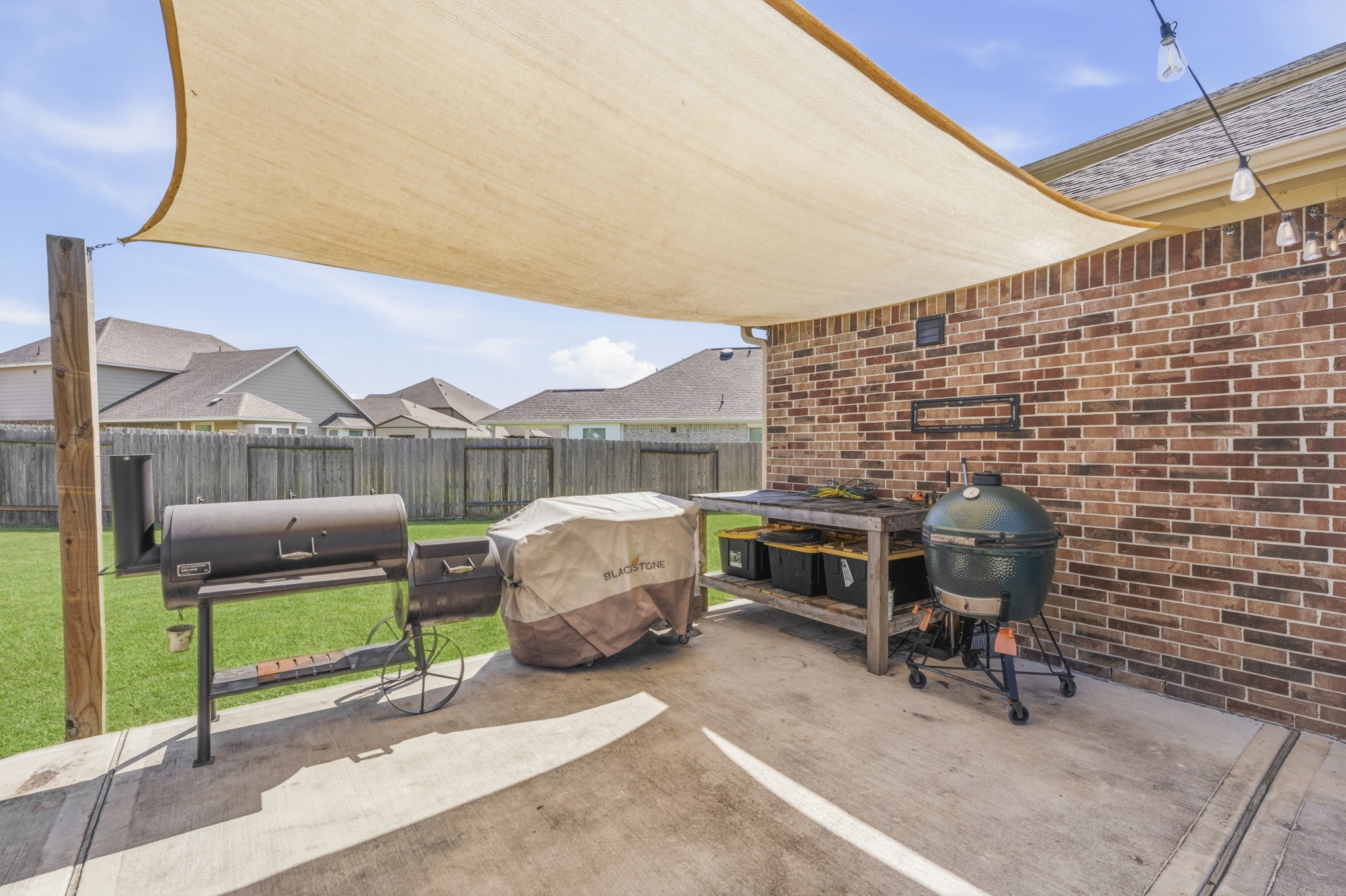 2401 Abbot Brk Drive Rosharon, TX 77583 - Photo 38 of 50 Just imagine the memorable cookouts and gatherings you’ll enjoy with family and friends in this inviting outdoor space. From casual afternoons to evenings spent dining under the stars, this backyard retreat is designed for making lasting memories. Workbench/gardener's bench included!