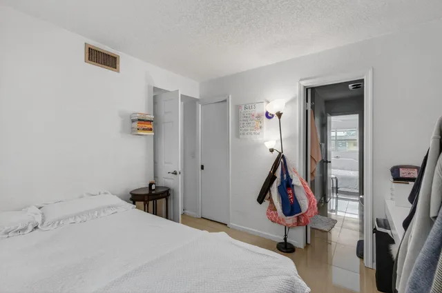 a bed room with a bed and furniture