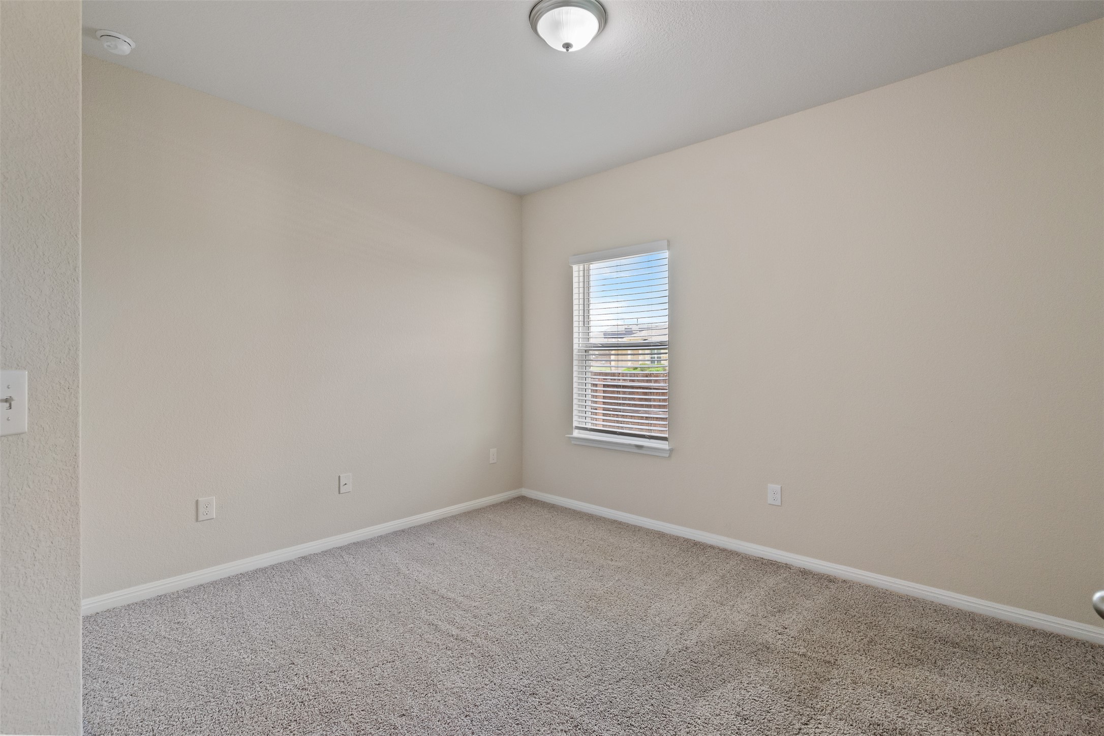 4125 Buffalo Ford Road Georgetown, TX 78628 - Photo 15 of 28 Carpeted empty room featuring baseboards