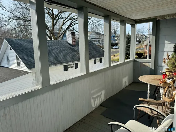 a view of balcony with furniture