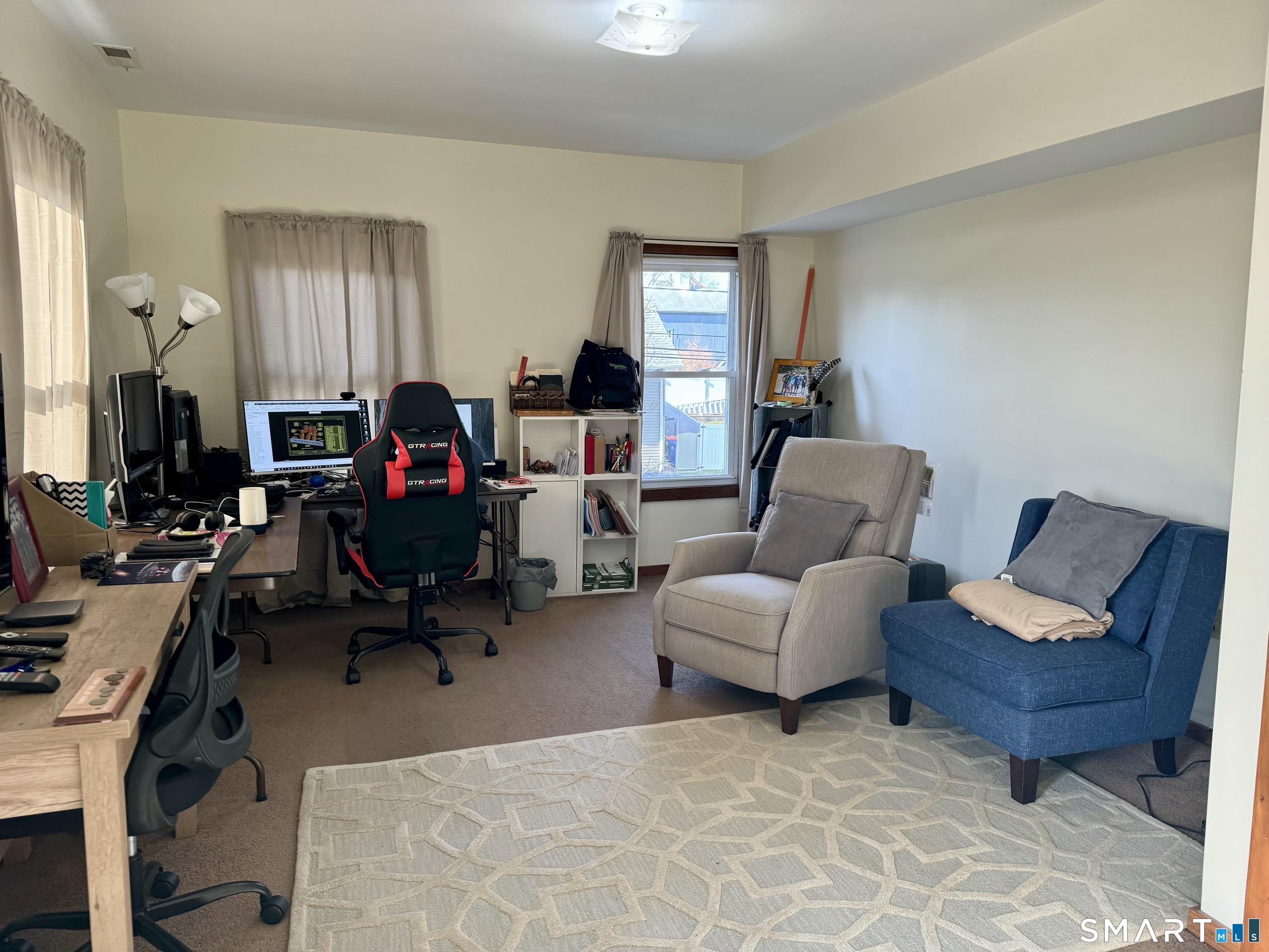 156 Fair Street, Unit 2 Wallingford, CT 06492 - Photo 2 of 15 a view of a livingroom with workspace and a couch