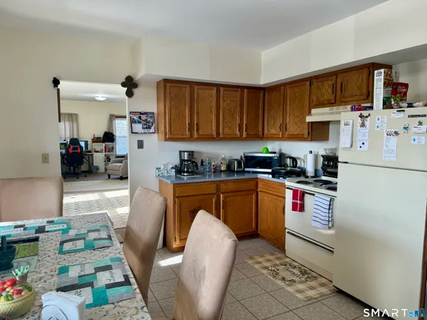 a kitchen with stainless steel appliances granite countertop a refrigerator sink and cabinets