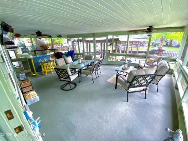 a view of a swimming pool with a patio