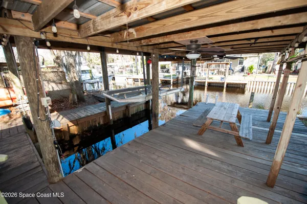 a view of a backyard with sitting area